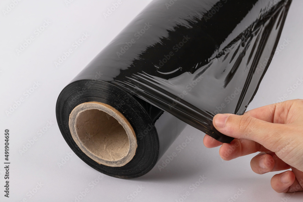 Roll of plastic cling film with black wrap. how long the roll of cling