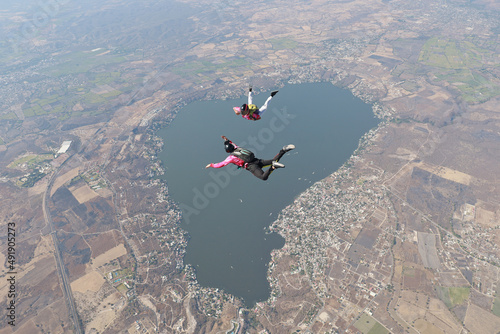 Skydivers are having fun in the sky.