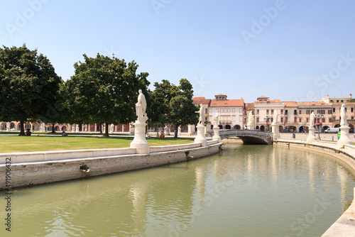 Large square Prato della Valle with canal and statues in Padua, Italy photo