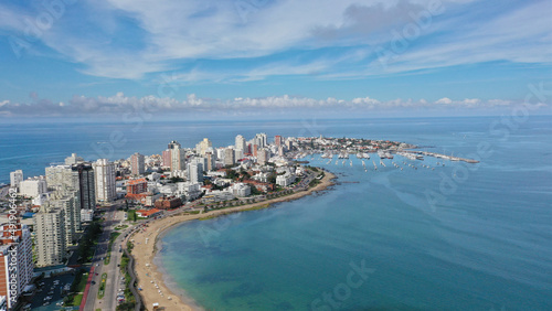 Aerial view of Punta del Este Playa Mansa beach with modern buildings and boats. Punta del Este, Maldonado State, Uruguay