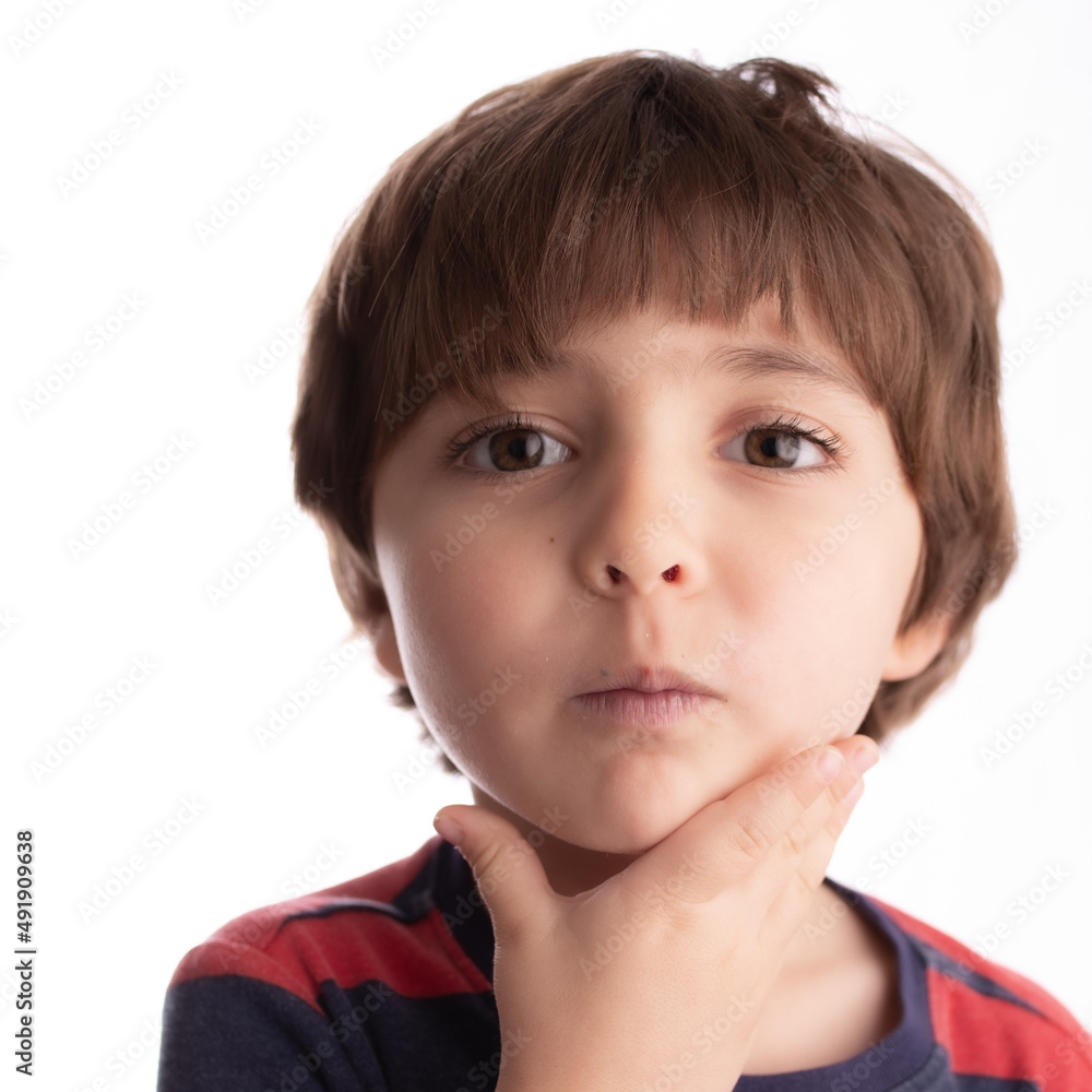 little boy making funny expressions and posing with many faces and thinking little boy making funny expressions and posing with many faces and thinking