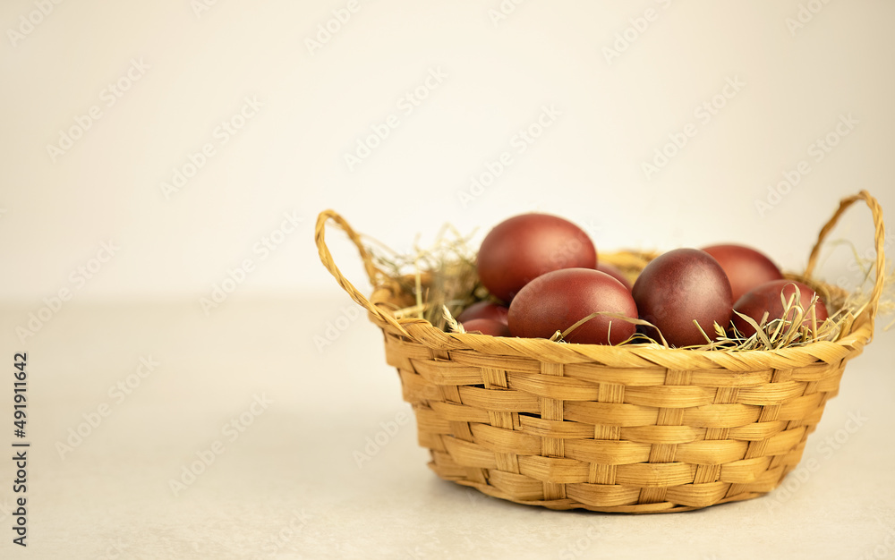 Egg collection in a wicker basket on white background Egg collection in a wicker basket on white background