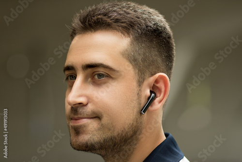 Man in wireless headphones, business banner