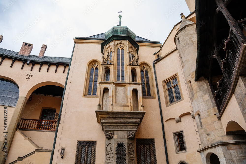 Kutna Hora, Central Bohemian, Czech Republic, 5 March 2022: Italian Courtyard or Vlassky dvur, medieval architecture gothic and renaissance, tower with lancet window and stained-glass windows