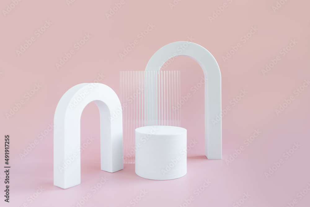 White geometric shapes on a pink bright background with space for text and design. Minimalistic composition of white geometric shapes of arches, triangles, cubes. Abstract composition for any text. White geometric shapes on a pink bright background with space for text and design. Minimalistic composition of white geometric shapes of arches, triangles, cubes. Abstract composition for any text.