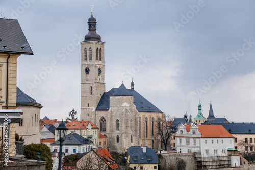 Kutna Hora, Central Bohemian, Czech Republic, 5 March 2022: Gothic stone Church of St. James or Kostel sv. Jakuba with bell and clock tower, medieval architecture at old town, lancet windows