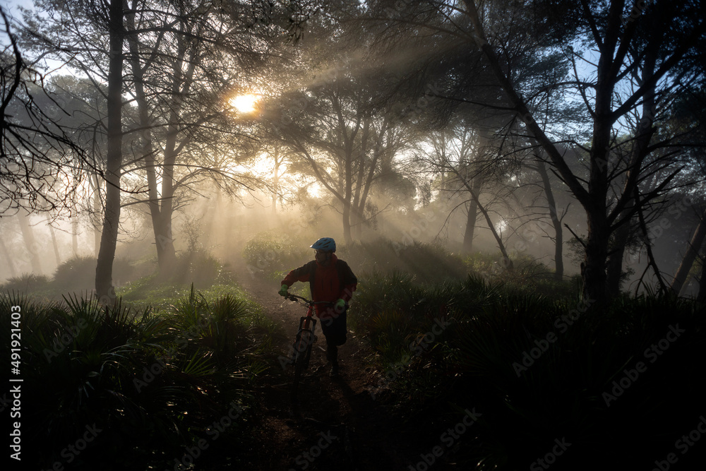 Young mountain biker in a beatiful foggy morning in Spain Young mountain biker in a beatiful foggy morning in Spain