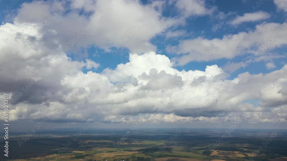 Aerial view at high altitude of dark cumulus clouds forming before rainstorm
