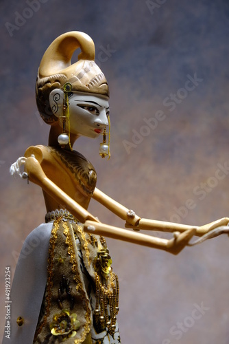 detail of an oriental statuette with golden headdress