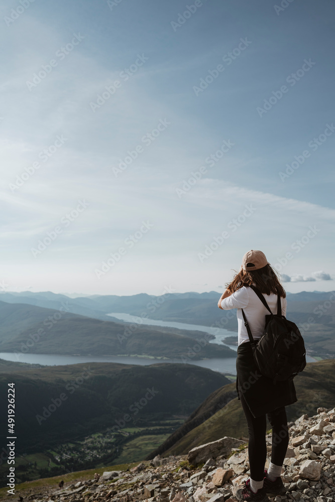 woman standing on top of the mountain  Ben Nevis Scotland