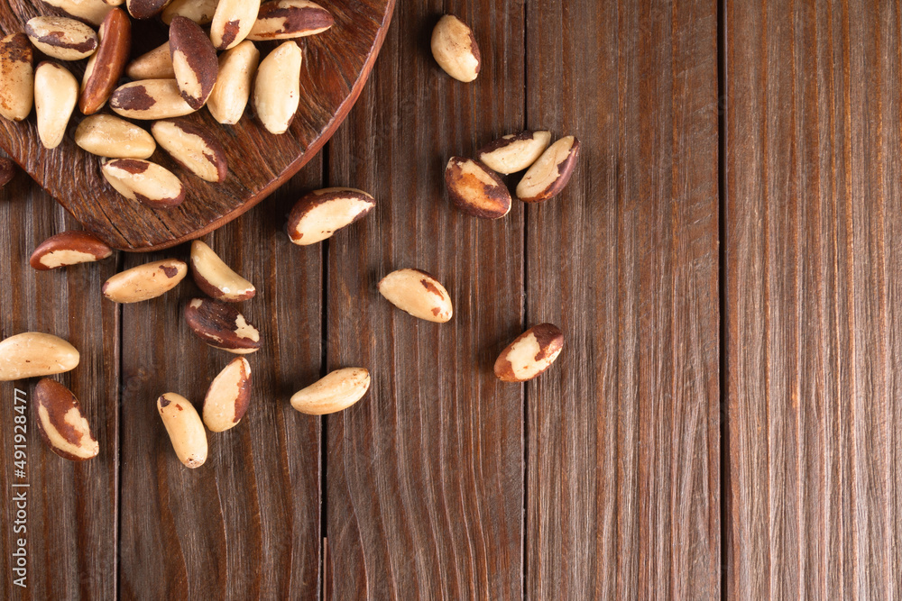 Obraz premium Brazil nuts on wooden background