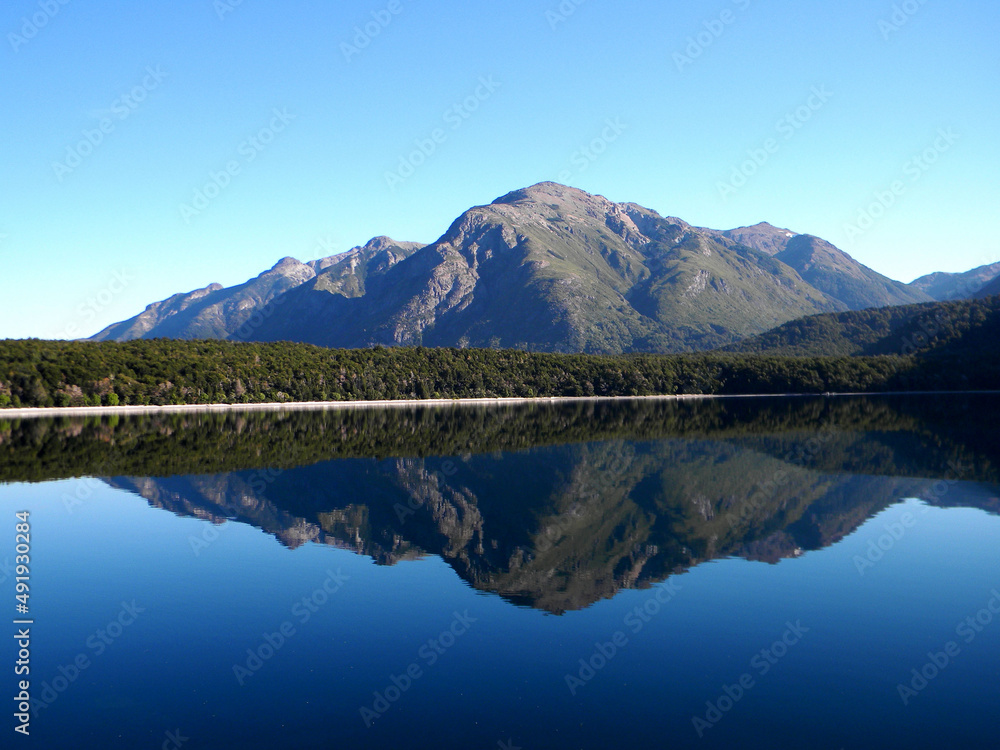 Reflection of the Andes mountains on a lake in Patagonia, Argentina. Los alerces national park