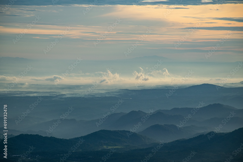 colorful sunrise at the highest peak of Mount Si Kunir, Mount Dieng, Wonosobo, Indonesia colorful sunrise at the highest peak of Mount Si Kunir, Mount Dieng, Wonosobo, Indonesia