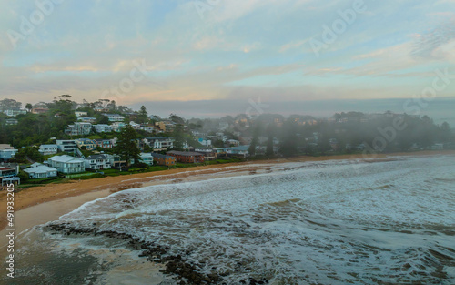 Photos Foggy aerial sunrise over the sea with clouds and sea foam