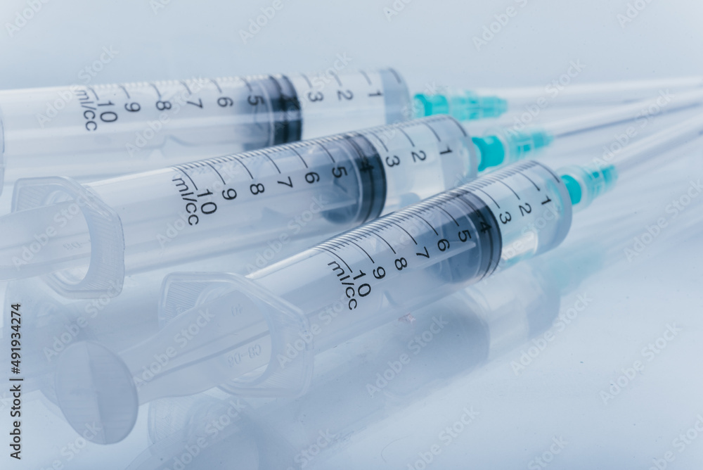 Medicine, Injection, vaccine and disposable syringe isolated, drug concept. Sterile vial medical. Medical Syringe needle. Macro close up on backgrounds gray. Medicine, Injection, vaccine and disposable syringe isolated, drug concept. Sterile vial medical. Medical Syringe needle. Macro close up on backgrounds gray.