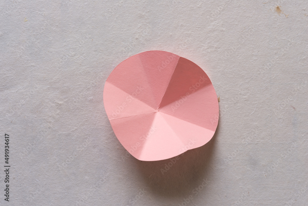 folded circle divided into eight triangular segments folded circle divided into eight triangular segments