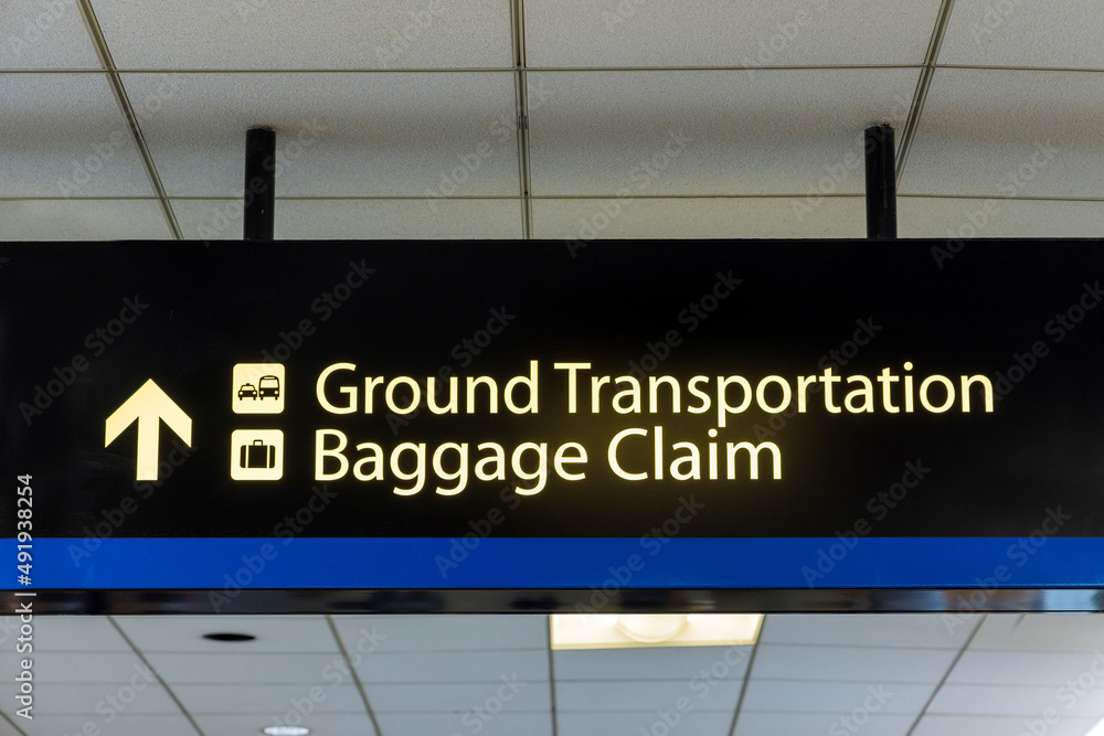 International Airport Sign Ground Transportation Baggage Claim in air terminal