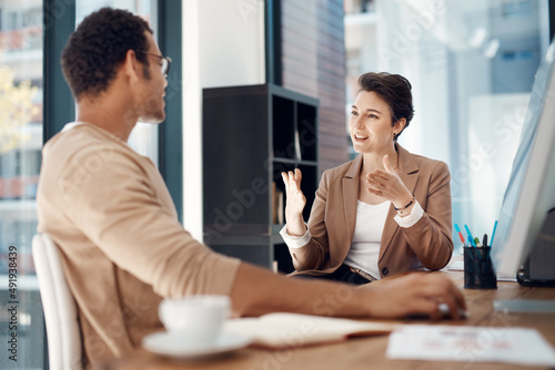 Getting her point across. Shot of two businesspeople having a discussion in an office.