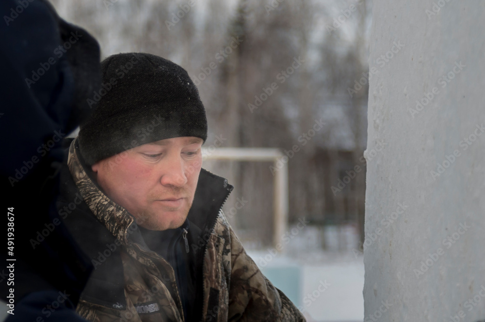Portrait of an installer at the construction of an ice town Portrait of an installer at the construction of an ice town