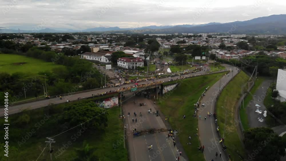 JAMUNDI, COLOMBIA - MAY 02, 2021: Citizens gather and protest against the government because a tax restructure. JAMUNDI, COLOMBIA - MAY 02, 2021: Citizens gather and protest against the government because a tax restructure.