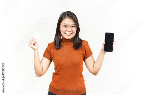 Holding Blank Bank Card and Smartphone With Blank Screen Of Beautiful Asian Woman Isolated On White