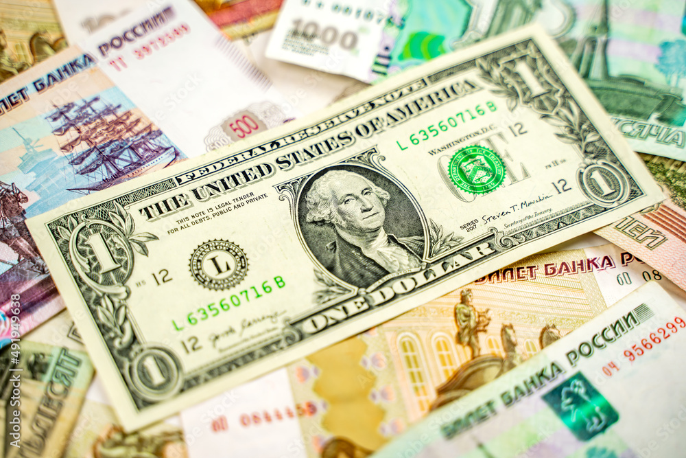 Russian and American paper money. Rubles and US dollars exchange rate. Russian and American paper money. Rubles and US dollars exchange rate.