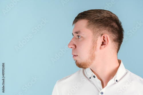 Portrait of a bearded man in profile turning his head to the right, copyspace