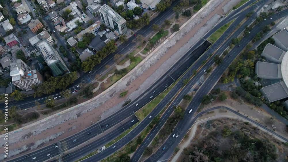Aerial top down dolly in of Mapocho river and cars driving in avenues and highway and Santiago city neighborhood buildings, Chile Aerial top down dolly in of Mapocho river and cars driving in avenues and highway and Santiago city neighborhood buildings, Chile