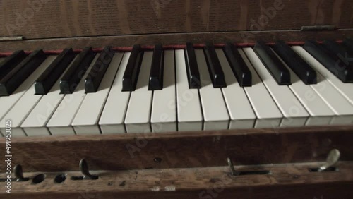 Old 20th century player piano, also known as pianola. photo