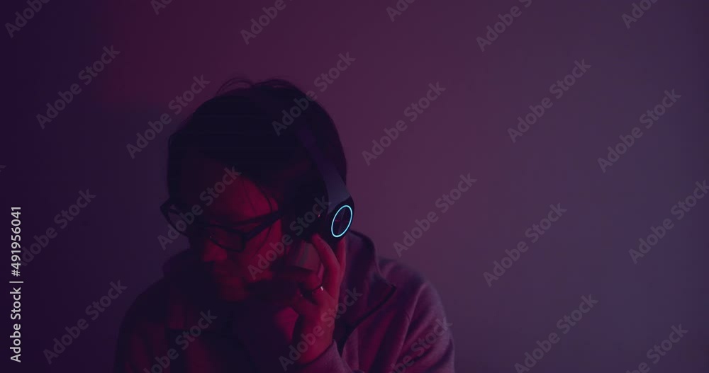 Close up asian man wear headphone with ring light. Concept for electronic digital music. Close up asian man wear headphone with ring light. Concept for electronic digital music.
