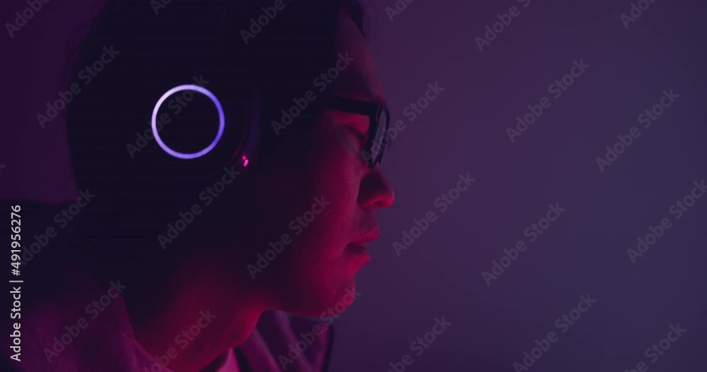 Close up asian man wear headphone with ring light. Concept for electronic digital music. Close up asian man wear headphone with ring light. Concept for electronic digital music.