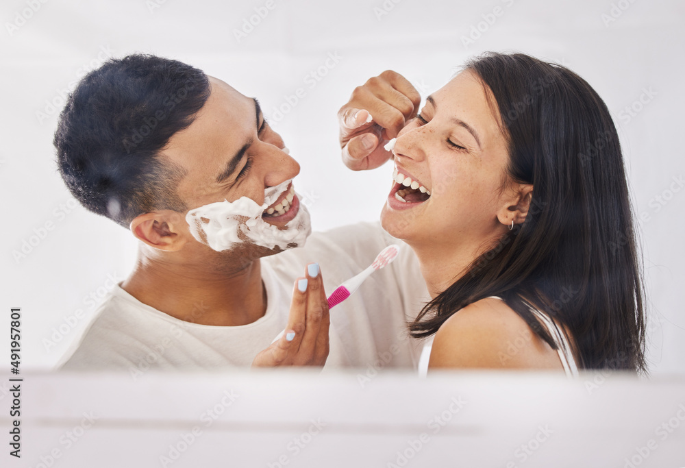 Youve got a little something on your nose. Shot of a happy young couple standing together in their bathroom and feeling playful while shaving. Youve got a little something on your nose. Shot of a happy young couple standing together in their bathroom and feeling playful while shaving.