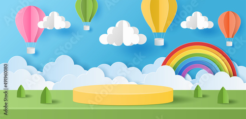 Paper cut of summer banner background with yellow color cylinder podium for products display presentation with colorful hot air balloons, cloud and rainbow. Vector illustration