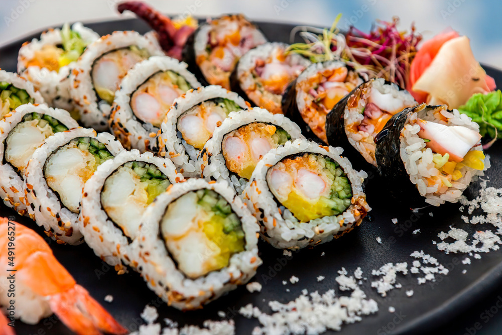 Overhead Japanese sushi food. Maki, rolls with crab, salmon, tuna