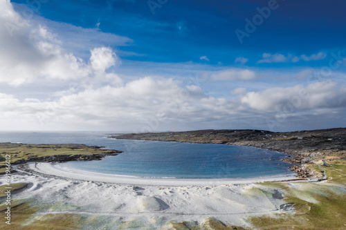 Aerial view on amazing Dog s bay beach near Roundstone town in county Galway  Sandy dunes and beach and blue turquoise color water. Cloudy sky. Popular travel destination. Gem of Connemara