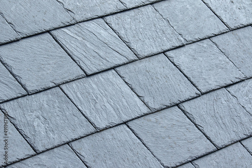 Vászonkép Closeup of clean grey slate roof tiles for use as a background texture