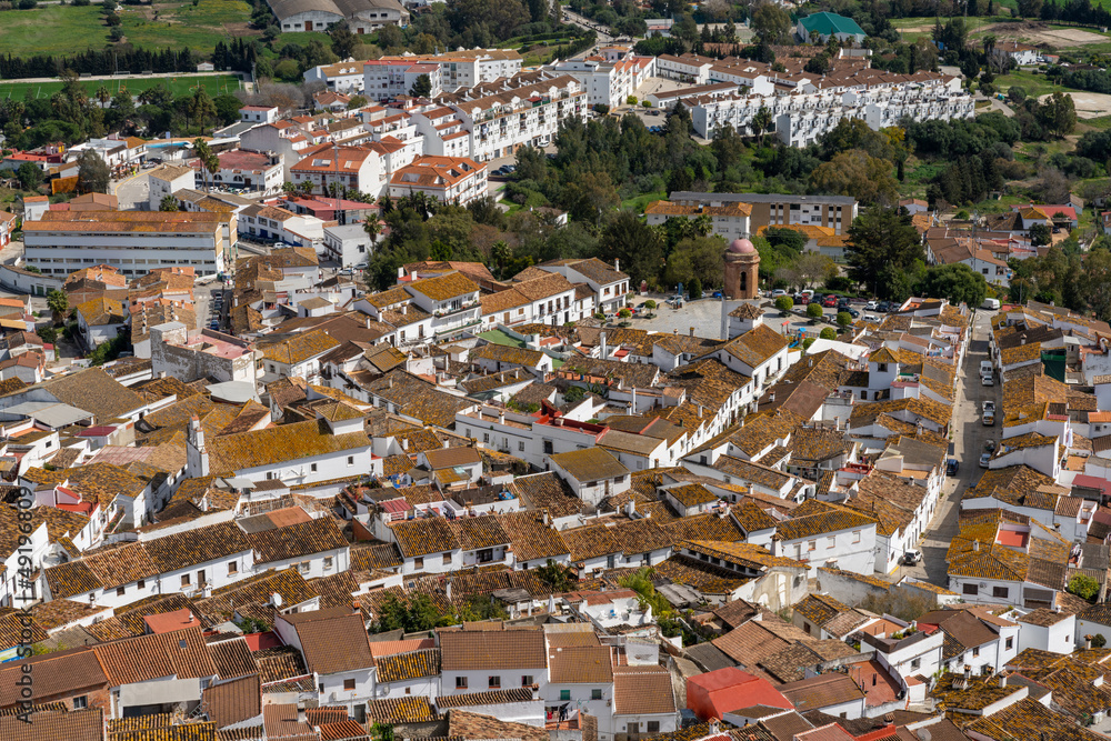 whitewashed village of Jimena de la Frontera high angle view with rooftops and church
