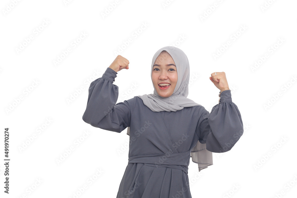 Fototapeta premium Wow and surprised asian muslim woman standing while clenching both hands. Isolated on white