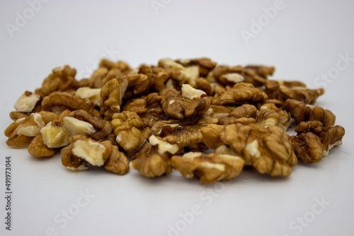 Peeled walnuts on white background