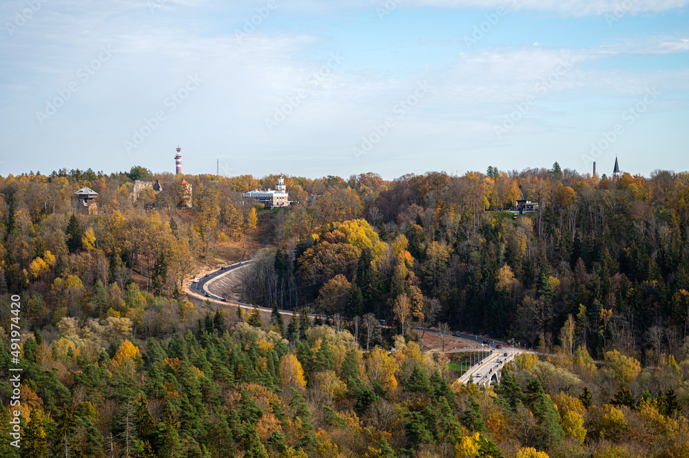 Obraz premium view from Krimulda manor to the valley of the Gauja National Park, the river Gauja, bridge and road