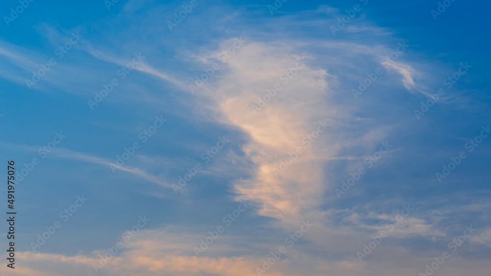 sunset evening sky with fluffy clouds