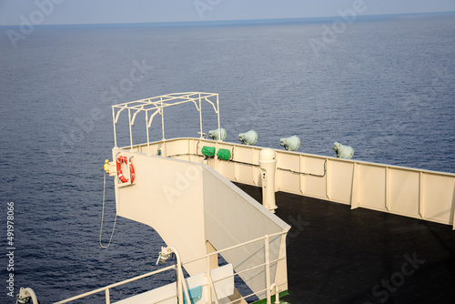 Bild auf Leinwand View of port side bridge wing of a cargo ship with Man overboard marker and lifebuoy