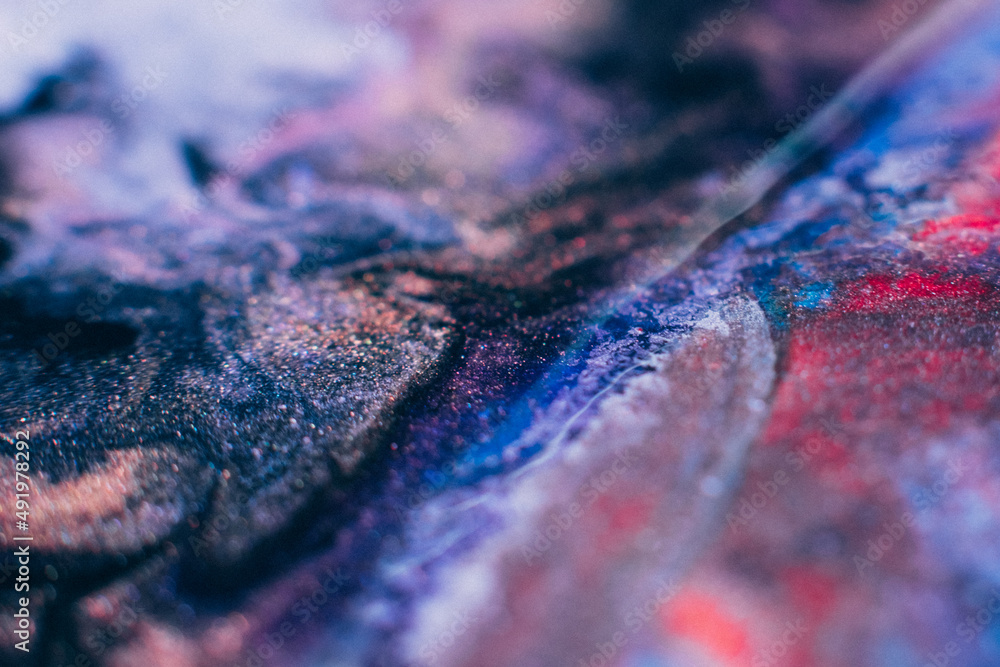 Fototapeta premium Liquid paint art. Macro ink background. Pink dark purple blue colors mix