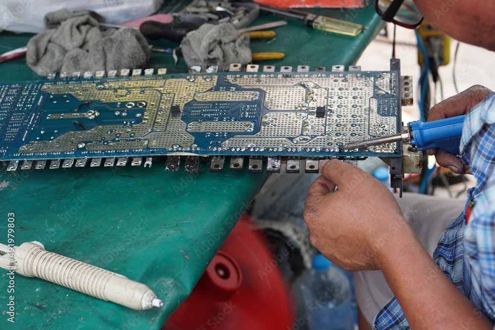 Fototapeta premium Welder repair an eletronic stuff
