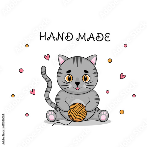 Cute gray cat plays with a ball of thread and the inscription "hand made" on a white background. Vector illustration.