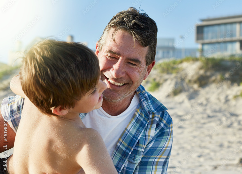 Summer days are best spent with family at the beach. Cropped shot of a father and son bonding together at the beach. Summer days are best spent with family at the beach. Cropped shot of a father and son bonding together at the beach.