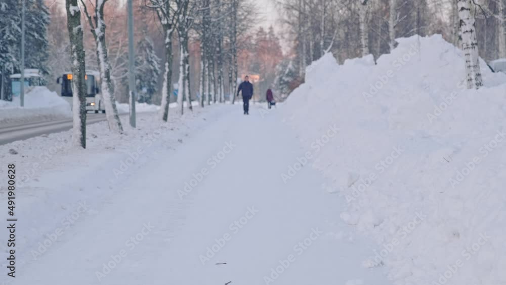 Snow-covered sidewalk after the strong snow blizzard in Finland. Snow-covered sidewalk after the strong snow blizzard in Finland.