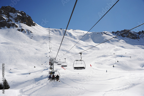 Ski lift over ski slopes in French alps