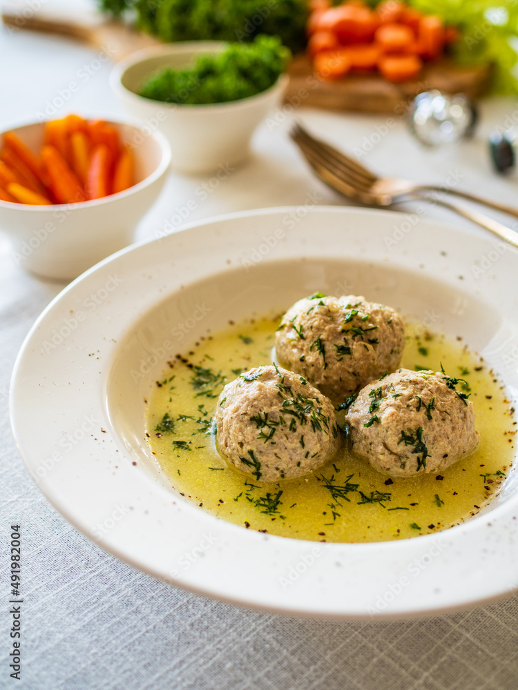 Boiled meatballs in dill sauce on white table
Boiled meatballs in dill sauce on white table