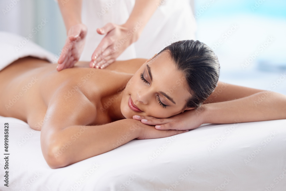 Treat yourself. Cropped shot of a beautiful young woman relaxing during spa treatment. Treat yourself. Cropped shot of a beautiful young woman relaxing during spa treatment.